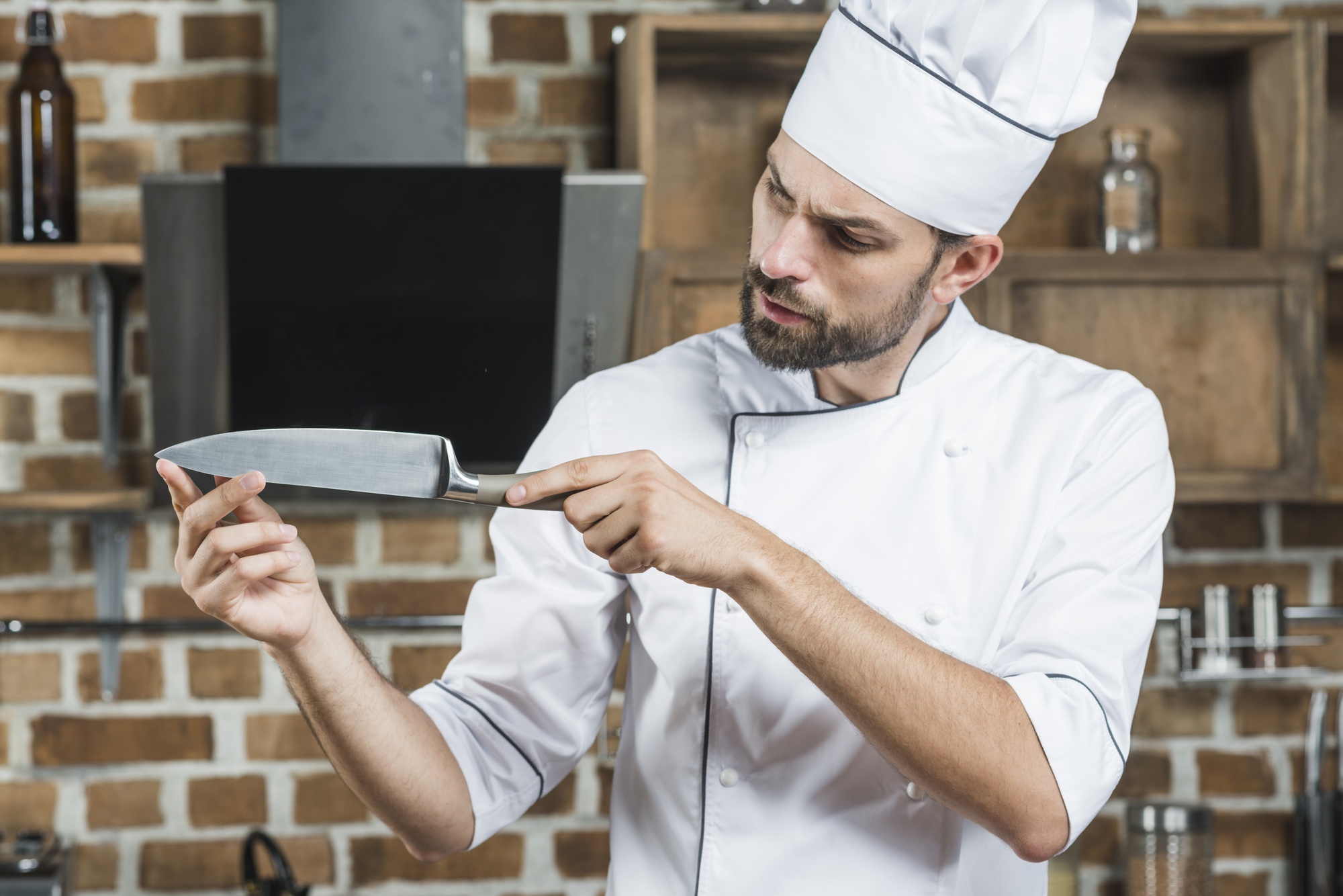 Chef demonstrating knife skills to student