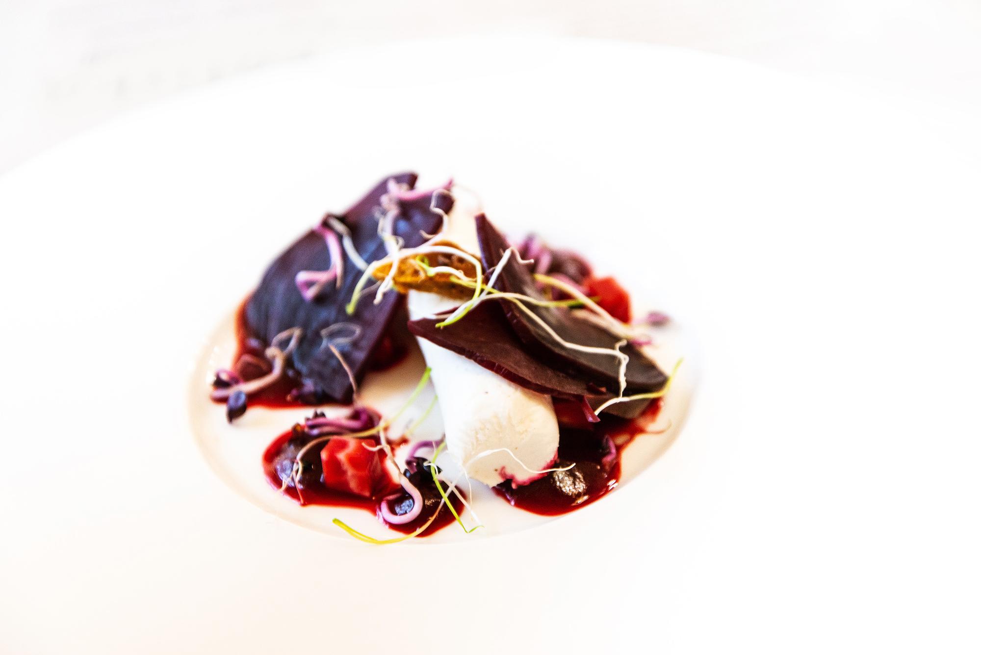 Close-up of plated starter with herbs